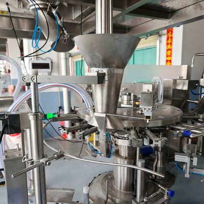 Filling station â Z-type elevator feeding product through the funnel into the pouch